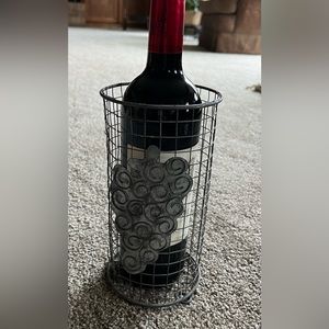 Wine bottle holder. Silver wire with grape accent.